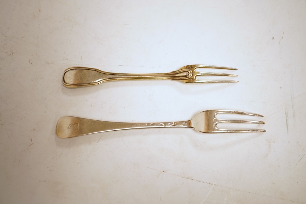 A collection of assorted mainly 18th century silver three pronged table forks, including a pair of dog nose, 19.1cm, most with indistinct or rubbed marks, together with a similar collection of thirteen silver three prong